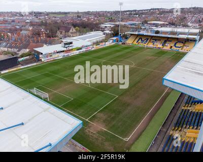 Mansfield Town England Football club One Call Stadium from the air drone photography looking down at MTFC league seating and pitch field no people Stock Photo