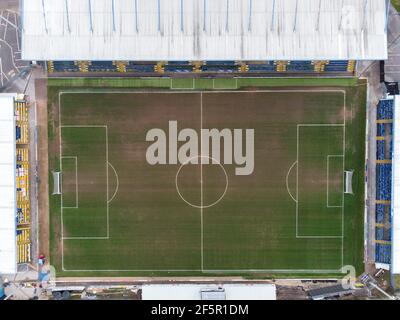 Mansfield Town England Football club One Call Stadium from the air drone photography looking down at MTFC league seating and pitch field no people Stock Photo