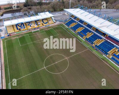 Mansfield Town England Football club One Call Stadium from the air drone photography looking down at MTFC league seating and pitch field no people Stock Photo