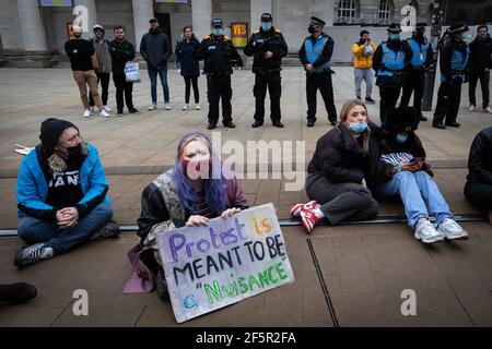 Manchester, UK. 27th Mar, 2021. Protesters stage a sit-in protest at St Peters Square during a 'Kill The Bill' demonstration. People come out to the streets to protest against the new policing bill. The new legislation will give the police more powers to control protests. Credit: Andy Barton/Alamy Live News Stock Photo