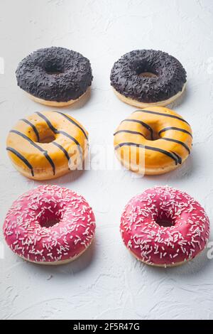 Set of glazed delicious donuts on white background Stock Photo - Alamy