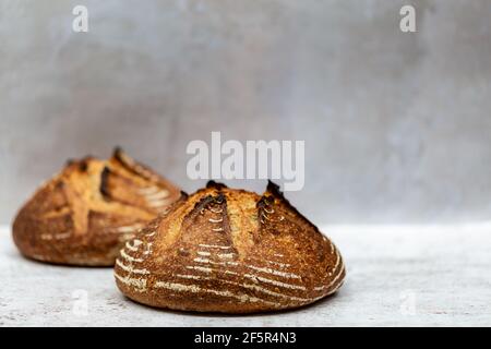 Two loaves of sourdough bread, with a shallow depth of field Stock Photo