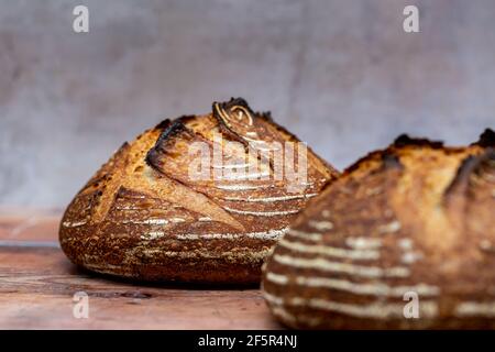 Two loaves of sourdough bread, with a shallow depth of field Stock Photo