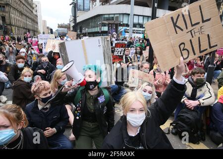 Manchester, UK. 27th March, 2021. Hundreds of protesters took to the streets in a 'Kill The Bill' demonstration.  The protesters caused hours of traffic chaos around the city centre by holding sit down protests.  Buses on Oxford Road had to be turned around and take alternative routes.  A late afternoon stand off with police occurred as the protesters blocked tram lines.  After requests to move on where ignored, the police Tactical Aid Unit moved in and grabbed several of the protesters.  Several arrests were made. Manchester, UK. Credit: Barbara Cook/Alamy Live News Stock Photo