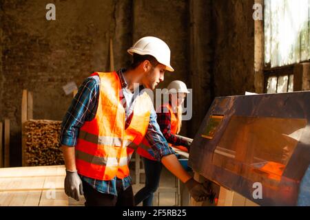 Workers on the wood factory manufacture production line Stock Photo