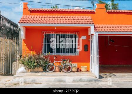 Cute orange house - An example of brightly colored architecture and homes in Mexico Stock Photo