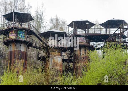 The rusty lime kilts with graffiti at Liban quarry site, Krakow, Poland where the Nazi labour camp was during WWII. Stock Photo