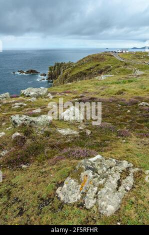 A stormy, rainy day looking out into the Atlantic towards Longships Lighthouse from Land's End in Cornwall, England. Stock Photo