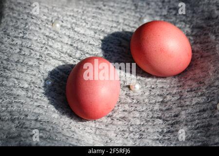 Pink Easter eggs on a gray background Stock Photo