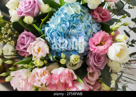 Flower bouquet with blue hydrangea and pink tulips Stock Photo