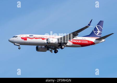 LOT Polish Airlines Boeing 737MAX 8 jet airliner plane on finals to land at London Heathrow Airport, UK, in blue sky. Special Poland paint scheme Stock Photo