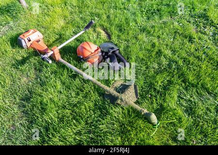 Suspicious man with a push reel lawn mower (OLVI008 OU474 F Stock