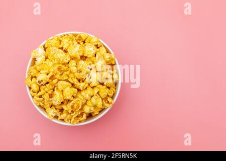 Caramel of pop icons in multicolored cups on pink background Stock Photo