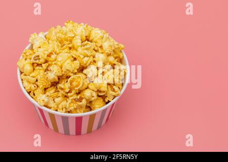 Caramel of pop icons in multicolored cups on pink background Stock Photo