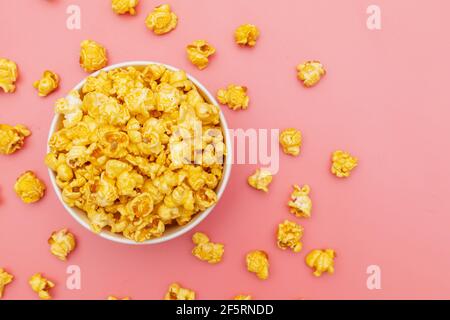 Caramel of pop icons in multicolored cups on pink background Stock Photo