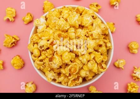 Caramel of pop icons in multicolored cups on pink background Stock Photo