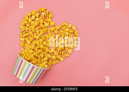 Caramel of pop icons in multicolored cups on pink background Stock Photo