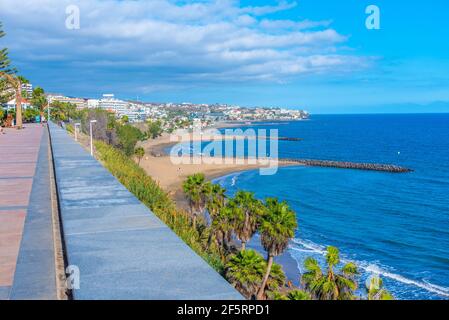 People are strolling at a seaside promenade at Maspalomas, Gran Canaria, Canary Island, Spain. Stock Photo