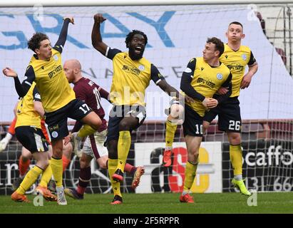 Tynecastle Park, Edinburgh, Scotland. UK 27th March-21. Scottish Championship Match .Hearts vs Queen of the South. Pics shows Queen of the South Niyah Joseph, Ayo Obileye, Connor Shields (10) & Ciaran Dickson (26) Credit: eric mccowat/Alamy Live News Stock Photo