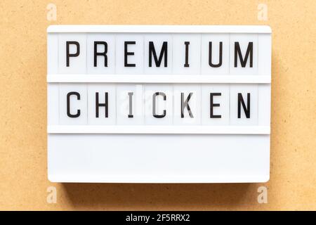 Lightbox with word premium chicken on wood background Stock Photo