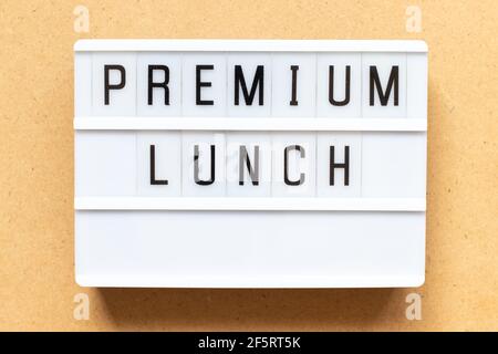 Lightbox with word premium lunch on wood background Stock Photo