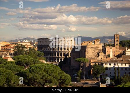 The Colosseum ( or Coliseum ) is an elliptical amphitheater in the center of Rome, Italy. Built of concrete and stone, it was the largest amphitheater Stock Photo