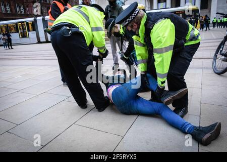 Manchester, UK. 27th Mar, 2021. A protester is being detained by police during the demonstration. People come out to the streets to protest against the new policing bill in a 'Kill The Bill demonstration'. The new legislation will give the police more powers to control protests. Credit: SOPA Images Limited/Alamy Live News Stock Photo