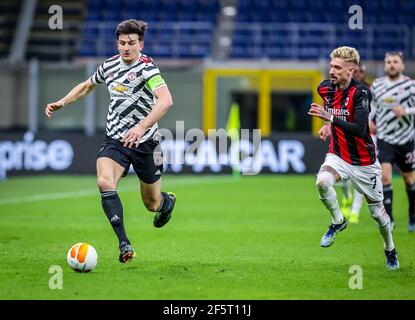 Harry Maguire of Manchester United FC in action during the UEFA Europa League 2020/21 Round of 16 Second Leg football match between AC Milan and Manchester United FC at San Siro Stadium.(Final score; AC Milan 0 - 1 Manchester United FC) Stock Photo
