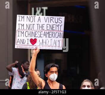 Washington, DC, USA, 27 March, 2021.  Pictured: A man holds a sign stating that he is a proud Chinese-American and not the enemy or coronavirus during the protest against anti-Asian violence.  Credit: Allison C Bailey/17�Թ����� Live News Stock Photo