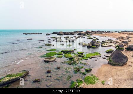 Rocky sea beach with boulders Stock Photo