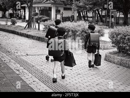 Japanese kids going to school in Fukuoka city (Japan), 04-07-2015 Stock Photo