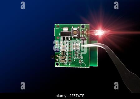 Microcontroller circuit board with infrared led light emitting diode electronic part closeup Stock Photo