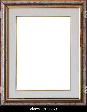 Old vintage wooden frame painted with silver and gold cracked patina with white canvas mat. Stock Photo