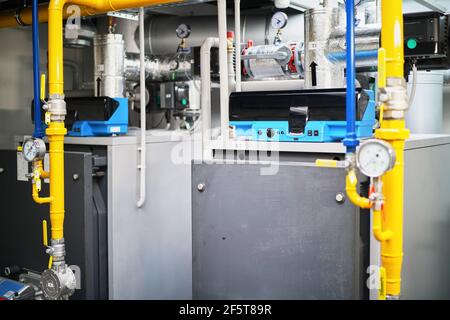 gas boilers boiler room plant tubes valves Stock Photo