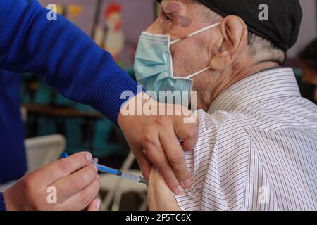 Tijuana, Mexico. 27th Mar, 2021. A man receives a dose of Sinovac COVID-19 vaccine from China at a vaccination center in Tijuana, Mexico, March 27, 2021. Tijuana, a border city between the United States and Mexico, began to vaccinate the local elderly aged 60 and above with COVID-19 vaccine. Credit: Joebeth Terriquez/Xinhua/Alamy Live News Stock Photo