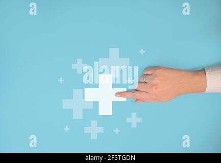Businesswoman pushing button with plus sign icon. Business growth, benefit, health insurance, development concept. Hand touching plus sign Stock Photo