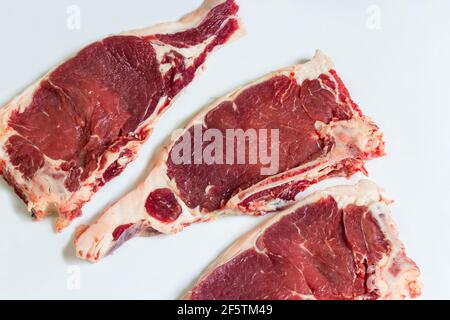 Freshly cut ribeye steaks on a butchers table. Prime grade ribeye steaks Stock Photo