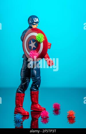 Captain America Action Figure fights against coronaviruses and protects all people on the planet.Bedford, UK, March 14, 2021 Stock Photo