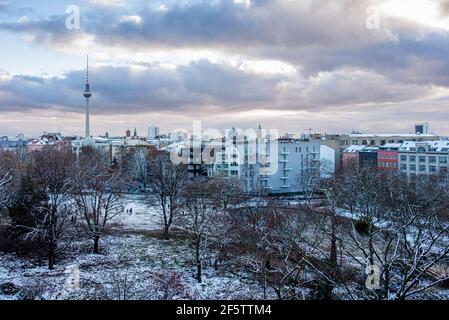 Berlin Skyline with TV tower & snow covered trees In Weinberg Park, Mitte, Berlin, Germany. Winter weather Stock Photo