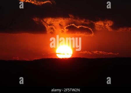 Fiery sunset in a cloudy sky Stock Photo