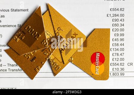 Credit card statement with cut up card, either to avoid debt or prevent identity theft. Stock Photo