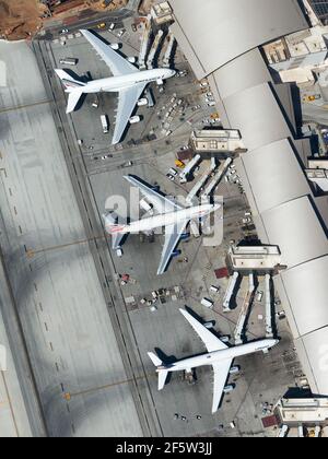 Three quadrijets airplanes side by side. Aerial view of Tom Bradley International Terminal (TBIT Terminal) at LAX Airport. Four engines aircraft. Stock Photo