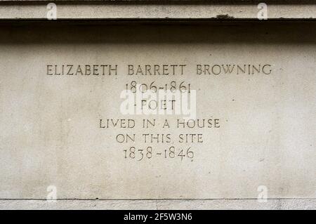 Carved stone inscription on house in Wimpole Street occupied by Elizabeth Barrett Browning. Stock Photo