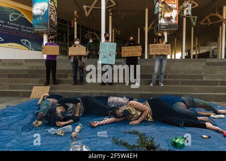 Barcelona, Spain. 28th Mar, 2021. Animal activists with their placards protest for animal rights in front of the Aquarium in Barcelona's Port Vell Credit: Matthias Oesterle/Alamy Live News Stock Photo