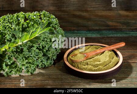 Curly kale leaves and powder - Brassica oleracea var. Stock Photo