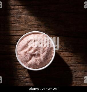 Fine pink Himalayan salt in a ceramic bowl Stock Photo