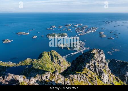 Houses on small rocky islands in the sea, view from the top of the mountain Festvagtind on Henningsvaer, Vagan, Lofoten, Nordland, Norway Stock Photo