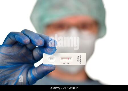 Medical staff shows negative antigen rapid test, test cassette, Corona crisis, Germany Stock Photo