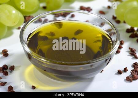 Grape seeds and grape seed oil (Vitis vinifera subsp. vinifera), grape seed oil Stock Photo