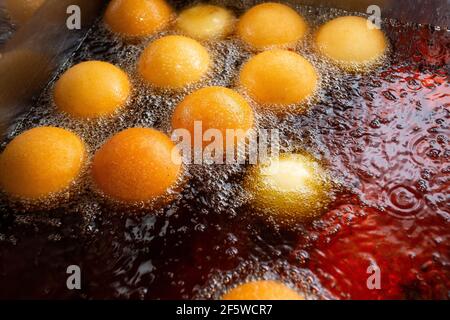 Buñuelos from Colombia in the process of cooking, traditional Colombian food. Stock Photo